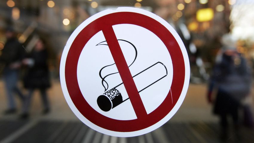 A sticker with a no smoking sign adorns the glass door of a Berlin shopping mall 31 January 2008. Germany, France and Portugal joined many of their neighbours with anti-smoking bans in bars, restaurants and cafes from 01 January 2008, lifting the grey haze that was part of their romantic atmosphere for more than a century. Europe started 2008 with a raft of new laws against smoking, air pollution and even junk food adverts, but some grumbled that the New Year's resolutions from the "nanny state" cramped their style.     AFP PHOTO JOHN MACDOUGALL (Photo credit should read JOHN MACDOUGALL/AFP/Getty Images)
