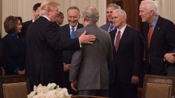 President Donald Trump speaks with Senate Majority Leader Mitch McConnell (L) as House Minority Leader Nancy Pelosi (L) Senate Minority Leader Chuck Schumer (3rd L) House Majority Leader Kevin McCarthy (3rd R), Vice President Mike Pence (2nd L) and Senate Majority Whip John Cornyn (R) during a reception with Congressional leaders on January 23, 2017 at the White House in Washington, DC. 