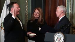 WASHINGTON, DC - JANUARY 23:  Mike Pompeo (L) is sworn in as CIA Director by Vice President Mike Pence (R) as wife Susan Pompeo (2nd L) looks on at Eisenhower Executive Office Building January 23, 2017 in Washington, DC. Pompeo was confirmed for the position by the Senate this evening.  (Photo by Alex Wong/Getty Images)