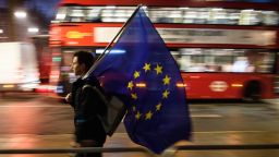 LONDON, ENGLAND - JANUARY 24:  A man carries a European Union flag outside the Supreme Court in Parliament Square ahead of the ruling on whether Parliament have the power to begin the Brexit process, on January 24, 2017 in London, England. The judgement will play an important role in how the Government proceeds with it's planned use of the EU's Article 50 exit clause.  (Photo by Leon Neal/Getty Images)