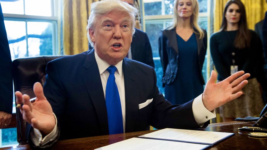 TOPSHOT - US President Donald Trump speaks before signing an executive order in the Oval Offoice at the White House in Washington, DC, on January 24, 2017.
US President Donald Trump signed executive orders January 24, 2017 reviving the construction of two controversial oil pipelines, but said the projects would be subject to renegotiation. rump gave an amber light to the Keystone XL pipeline -- which would carry crude from Canada to US refineries on the Gulf Coast -- and an equally controversial pipeline crossing in North Dakota.
 / AFP / NICHOLAS KAMM        (Photo credit should read NICHOLAS KAMM/AFP/Getty Images)