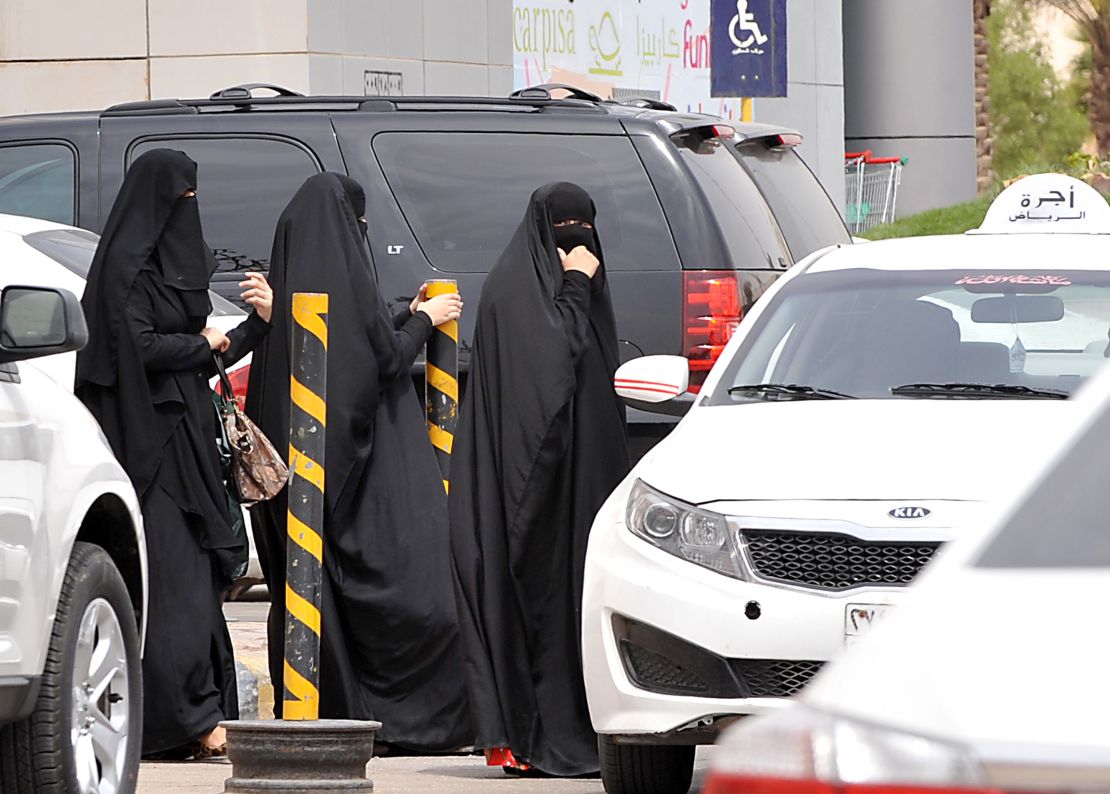 Saudi women leave a mall in the capital Riyadh in 2014, when activists urged women to defy a traditional driving ban and get behind the wheel. 