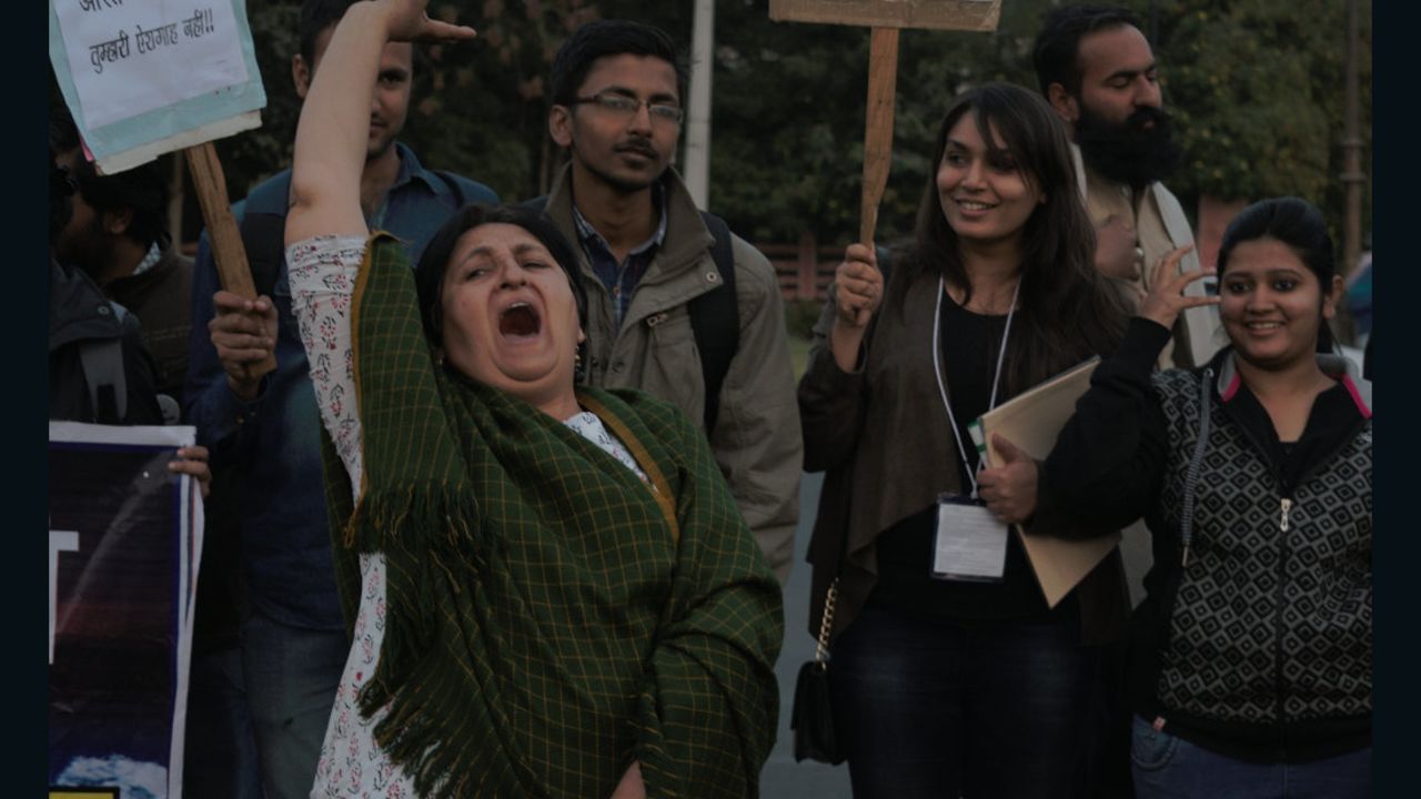 Long-time activist, Nisha Sidhu, leads the younger protesters in a chant, at Jaipur's #IWillGoOut march.