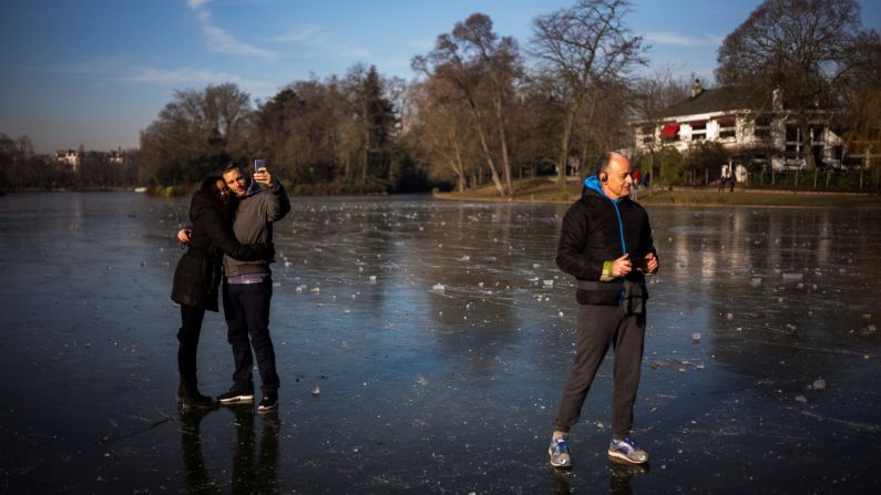 A couple takes a selfie on a frozen Paris lake on Sunday, January 22.