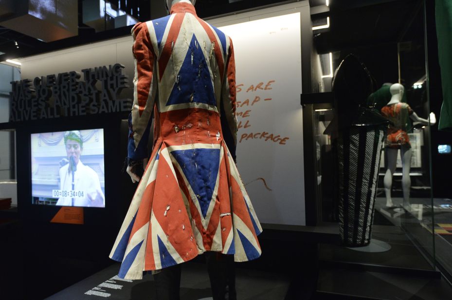 Designed for David Bowie for the 1996 VH1 Fashion Awards, the now iconic "Union Jack" frock with its frilly black-lace cuffs is one of Alexander McQueen's earliest designs. The theme was revisited in his later creations, including scarves and clutch bags carrying the distinct red, white and blue colors of the Union flag.<br />