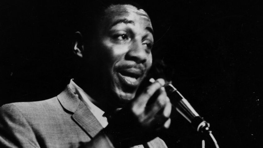 Black comedian Dick Gregory at the microphone, 1962.  (Photo by Three Lions/Getty Images)