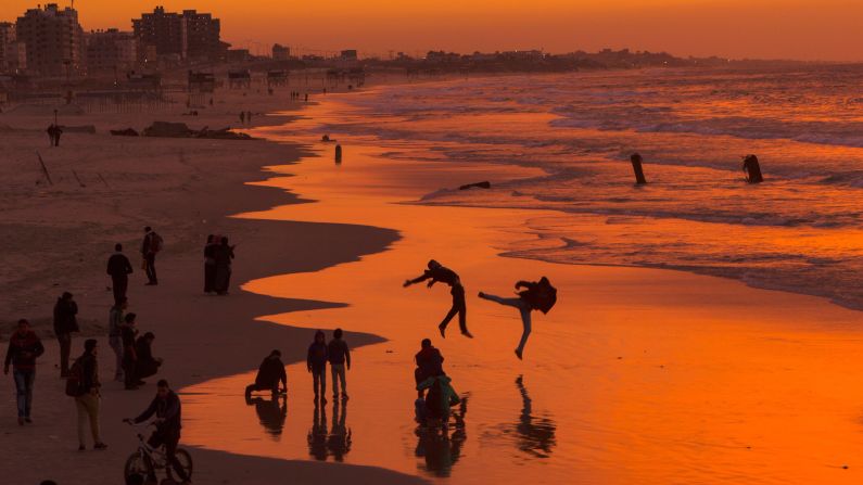 <strong>Gaza City:</strong> Palestinians enjoy the sunset on one of the city's beaches. Gaza City is home to about half a million people. 