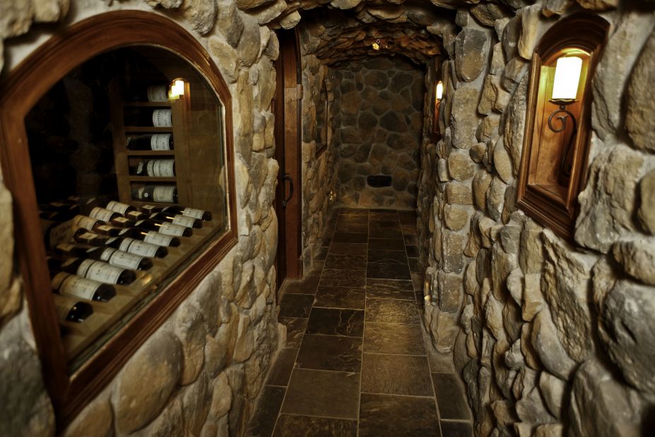 To access the cellar, guests climb down a spiral wrought-iron staircase that's hidden behind an unmarked door. The steep, narrow climb leads to the low-lit cellar, where two intimate dining rooms provide an atmospheric spot for private tastings.