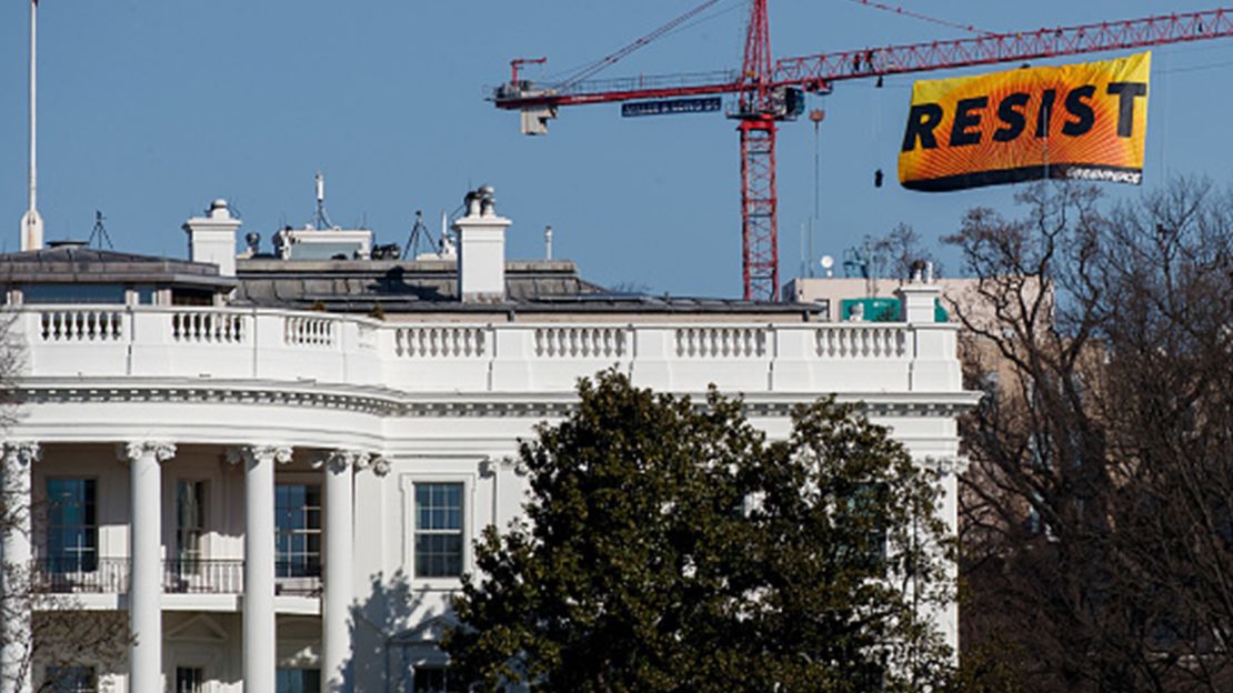 Protesters unfurled a banner atop a crane near the White House last week.