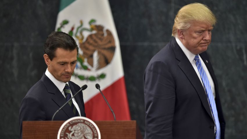 US presidential candidate Donald Trump (R) and Mexican President Enrique Pena Nieto prepare to deliver a joint press conference in Mexico City on August 31, 2016.
Donald Trump was expected in Mexico Wednesday to meet its president, in a move aimed at showing that despite the Republican White House hopeful's hardline opposition to illegal immigration he is no close-minded xenophobe. Trump stunned the political establishment when he announced late Tuesday that he was making the surprise trip south of the border to meet with President Enrique Pena Nieto, a sharp Trump critic.
 / AFP / YURI CORTEZ        (Photo credit should read YURI CORTEZ/AFP/Getty Images)