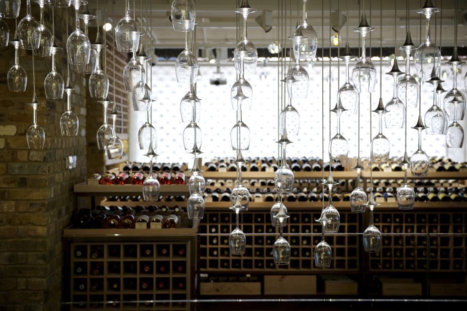 Under a lighting fixture featuring hundreds of Riedel wine glasses, this London boutique carries wines ranging from everyday bottles to unique collectables. 