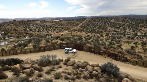 A US Border Patrol vehicle stands guard along the US-Mexico border on September 26, 2016, in Jacamba Hot Springs, California. According to a Congressional Research report, the first fencing was constructed near San Diego in 1990. 