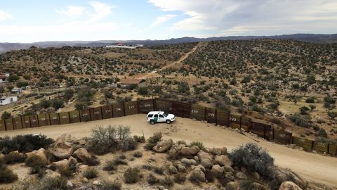 A US Border Patrol vehicle stands guard along the US-Mexico border on September 26, 2016, in Jacamba Hot Springs, California. According to a Congressional Research report, the first fencing was constructed near San Diego in 1990.