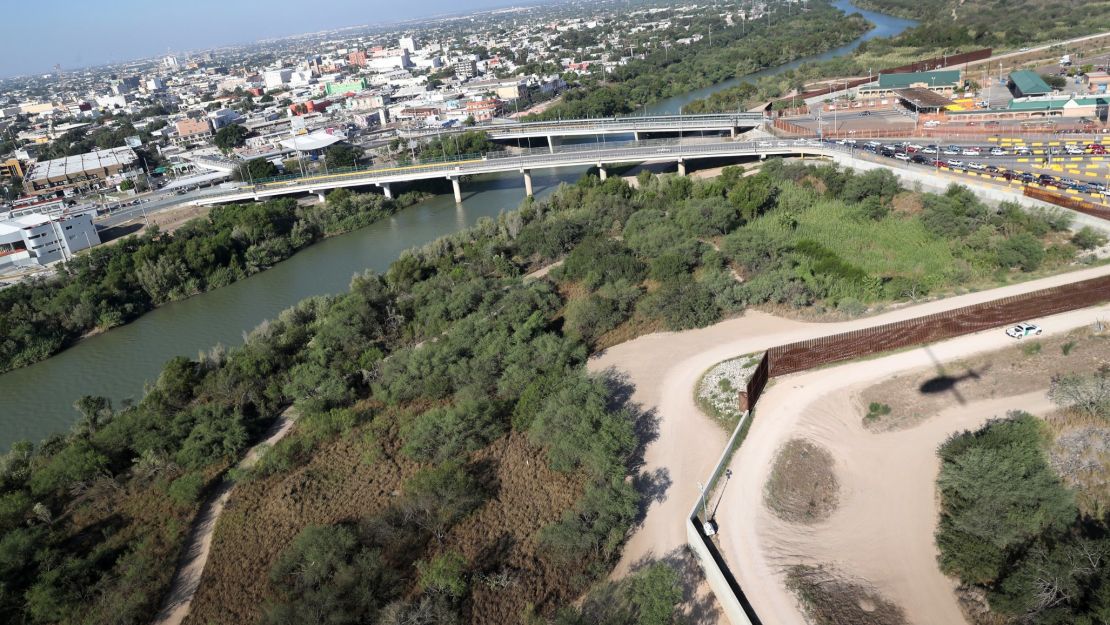 In Hidalgo, Texas, the border fence runs by a bridge that connects the United States and Mexico. 