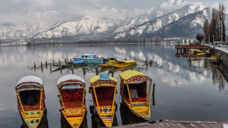 <strong>Srinagar, Kashmir: </strong>Traditional wooden shikara boats are moored in the popular Dal Lake tourist spot. The Zabarwan mountain range lies beyond. 