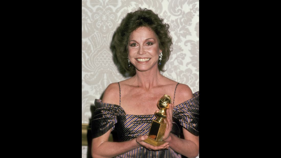 Moore holds up the Golden Globe Award she won for "Ordinary People."