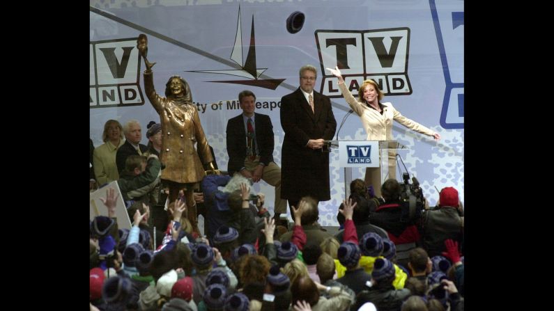 Moore re-enacts her famous hat toss afer a bronze statue of her was unveiled in 2002. The statue was unveiled in Minneapolis, where "The Mary Tyler Moore Show" takes place.