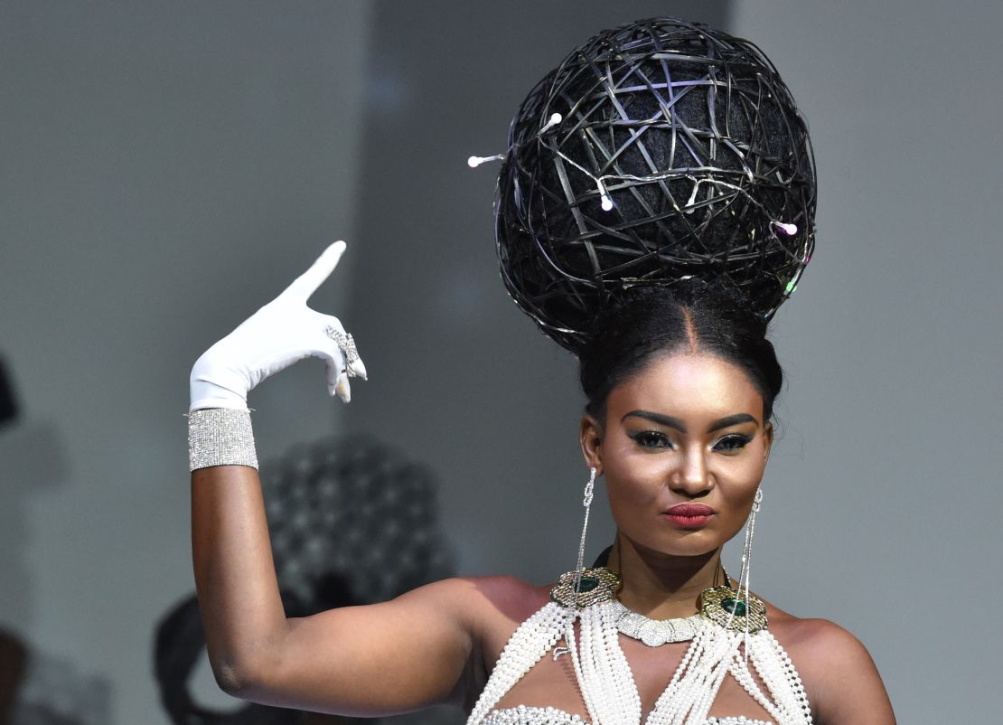 A model presents a hair creation by Ivory Coast hairstylist Dieudonne Senato, during the 10th "Afrik" fashion show in Abidjan on June 13, 2015. 