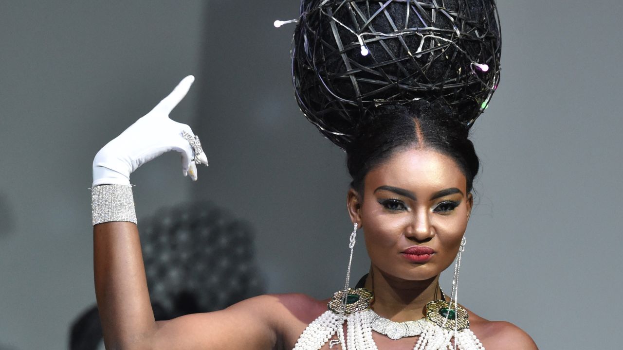 A model presents a hair creation by Ivory Coast hairstylist Dieudonne Senato, during the 10th "Afrik" fashion show in Abidjan on June 13, 2015. 