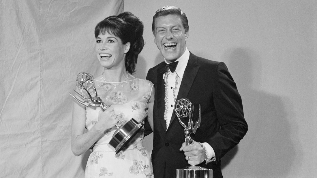 Moore and Van Dyke hold Emmy Awards in 1966. Moore won two Emmys for "The Dick Van Dyke Show" and four for "The Mary Tyler Moore Show."