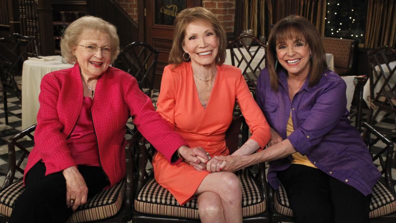 From left, Betty White, Moore and Valerie Harper sit together at a 2013 reunion of cast members from "The Mary Tyler Moore Show."