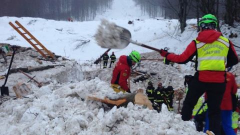 Volunteers and rescuers work Wednesday at the scene of the Hotel Rigopiano avalanche.