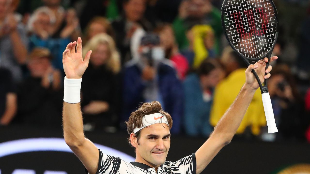 Roger Federer of Switzerland celebrates winning match point in his semifinal match against Stan Wawrinka of Switzerland on day 11 of the 2017 Australian Open at Melbourne Park on January 26, 2017 in Melbourne, Australia.  