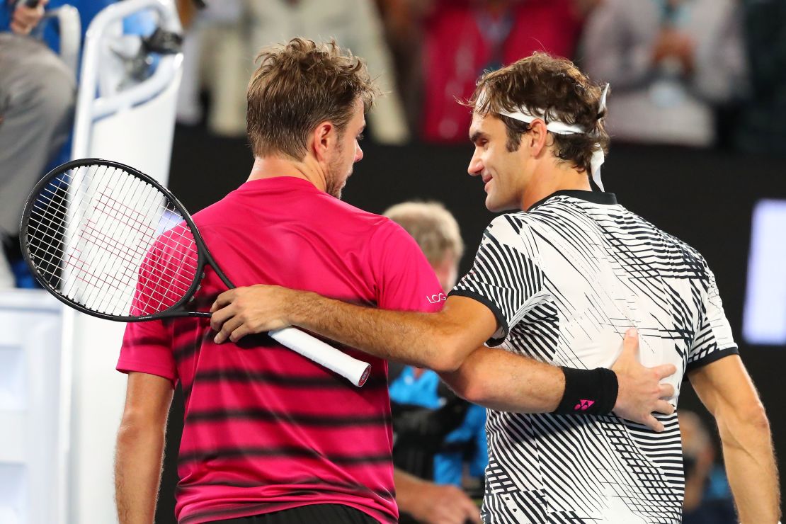 Stan Wawrinka of Switzerland congratulates Roger Federer of Switzerland.  