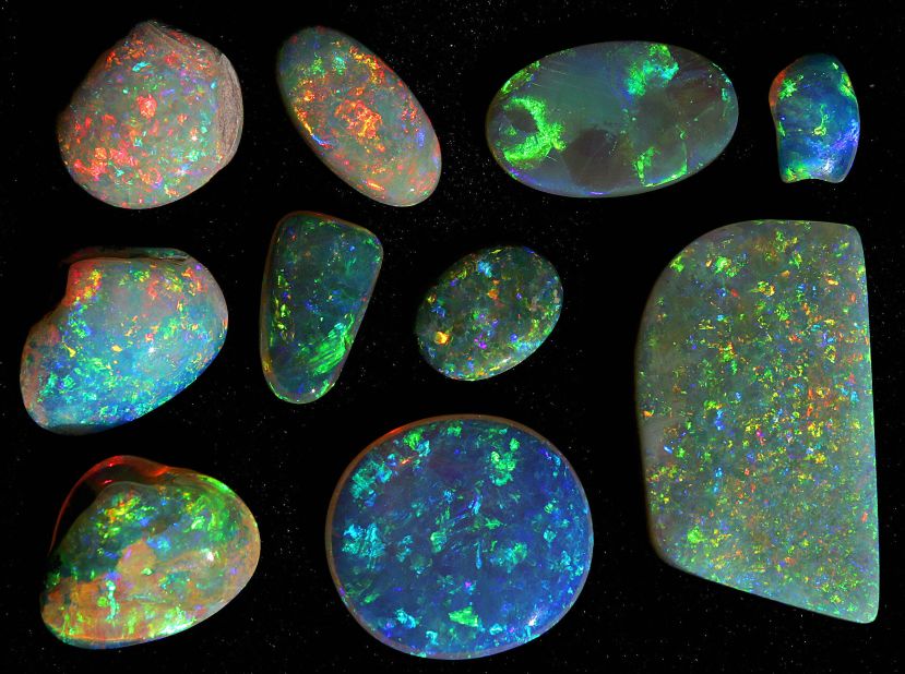 Opals are highly colored, semi-precious stones that form from closely packed silica deposits found in the dry ground of arid regions. 