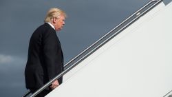 TOPSHOT - US President Donald Trump boards Air Force One at Andrews Air Force Base in Maryland on January 26, 2017 as he departs to attend a Republican retreat in Philadelphia. / AFP / NICHOLAS KAMM        (Photo credit should read NICHOLAS KAMM/AFP/Getty Images)