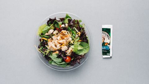 Order the bacon ranch grilled chicken salad and omit the bacon to lower the calories (from 320 to 230) and sodium (from 1,090 milligrams to 730 milligrams). Use only half the packet of ranch dressing to bring the salad total to 330 calories. 