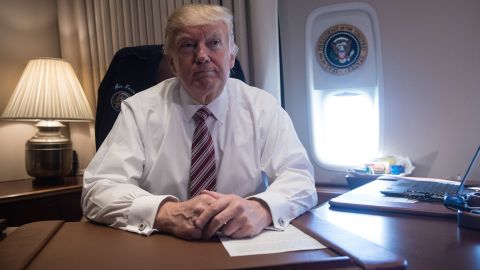 US President Donald Trump poses in his office aboard Air Force One at Andrews Air Force Base in Maryland after he returned from Philadelphia on January 26, 2017. Nicholas Kamm/AFP/Getty Images