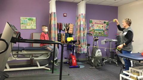 January 2017:  Three times a week, Spencer does physical therapy at St. Louis Children's Hospital. Pictured with Spencer is Carol Hyde, PT, who has been working with Spencer prior to his transplant.