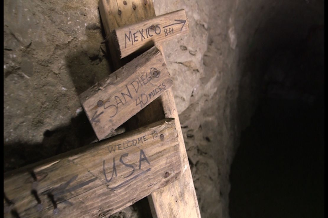A makeshift distance marker in a tunnel wryly gives some vital distance numbers.