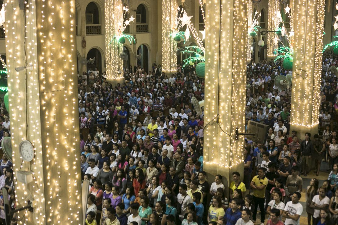 Churchgoers attending the Simbang Gabi (Dawn Mass) mass at the Redemptorist church presided over by Catholic Priest Fr. Amado Picardal in Paranaque City  Thursday December 22, 2016.  