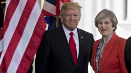 U.S. President Donald Trump, left, stands with Theresa May, U.K. prime minister, while arriving to the West Wing of the White House in Washington, D.C., U.S., on Friday, Jan. 27, 2017. The British prime minister is planning to pitch a free-trade deal to the new U.S. leader just as the reality of a new era of protection for American workers sinks in. Photographer: Andrew Harrer/Bloomberg via Getty Images