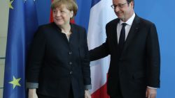 BERLIN, GERMANY - JANUARY 27:  French President Francois Hollande and German Chancellor Angela Merkel depart after speaking to the media prior to talks at the Chancellery on January 27, 2017 in Berlin, Germany. The two leaders are meeting in Berlin on the same day that British Prime Minister Theresa May is meeting new U.S. President Donald Trump for the first time in Washington, D.C.  (Photo by Sean Gallup/Getty Images)