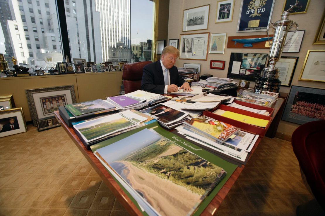 Donald Trump works at his desk in his New York office, Monday, Nov. 22, 2010. (AP Photo/Richard Drew)