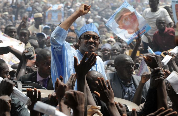 Buhari salutes a crowd during a presidential rally in 2011.