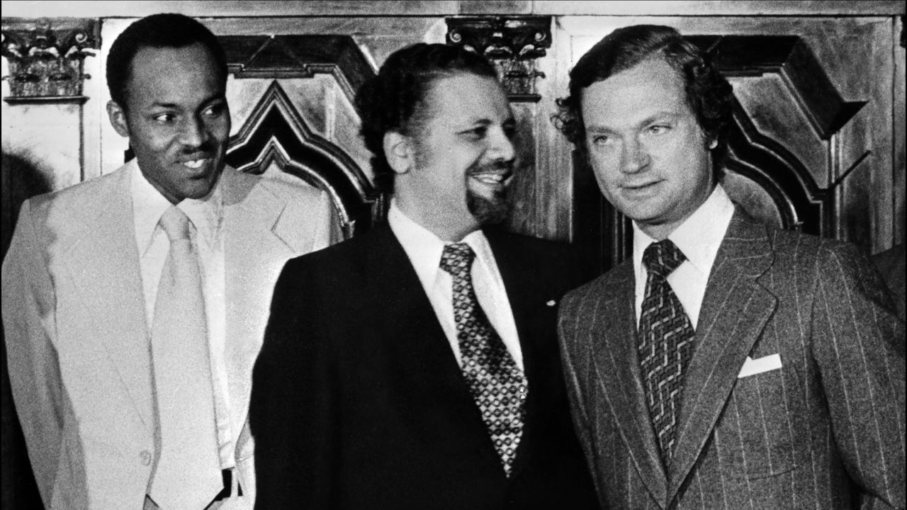 Before he was Nigeria's President, Buhari was an officer in the country's army. Here, he stands next to Saudi Sheikh Ahmed Zaki Yamani, center, and Swedish King Carl Gustaf during an OPEC summit in Stockholm, Sweden, in 1977.