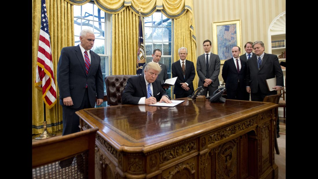 US President Donald Trump <a href="http://www.cnn.com/2017/01/23/politics/donald-trump-executive-orders-executive-actions/" target="_blank">signs three executive orders</a> in the White House Oval Office on Monday, January 23. The orders <a href="http://www.cnn.com/2017/01/23/politics/trans-pacific-partnership-trade-deal-withdrawal-trumps-first-executive-action-monday-sources-say/" target="_blank">removed the United States from the Trans-Pacific Partnership,</a> enacted a <a href="http://money.cnn.com/2017/01/12/news/economy/trump-federal-worker-freeze-promise/" target="_blank">federal-employee hiring freeze</a> and <a href="http://money.cnn.com/2017/01/12/news/economy/trump-federal-worker-freeze-promise/" target="_blank">reinstated the "Mexico City policy" on abortion funding.</a> That policy bars international nongovernmental organizations from receiving US government funding if they perform or promote abortions.