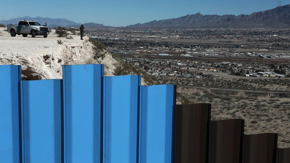 A border-patrol agent stands near a fence separating Juarez, Mexico, from Sunland Park, New Mexico, on Wednesday, January 25. President Trump <a href="http://www.cnn.com/2017/01/25/politics/donald-trump-build-wall-immigration-executive-orders/index.html" target="_blank">has promised to build a border wall </a>between Mexico and the United States.