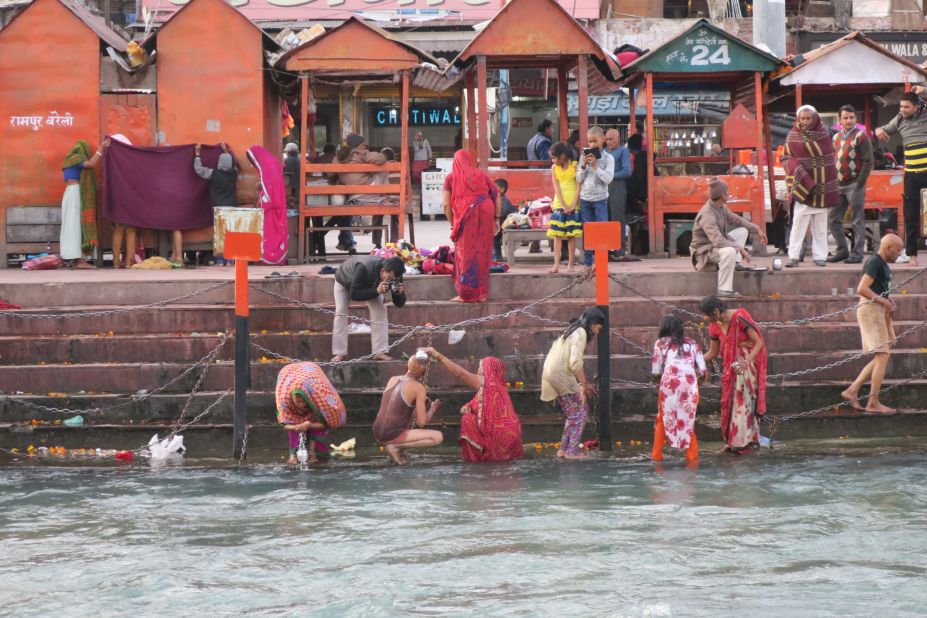 <strong>Feet-dipping: </strong>Dipping your feet in the Ganges is tradition -- as displayed by this group in Haridwar. But the river runs rapidly and the banks can be slippery with moss, so do exercise caution.  