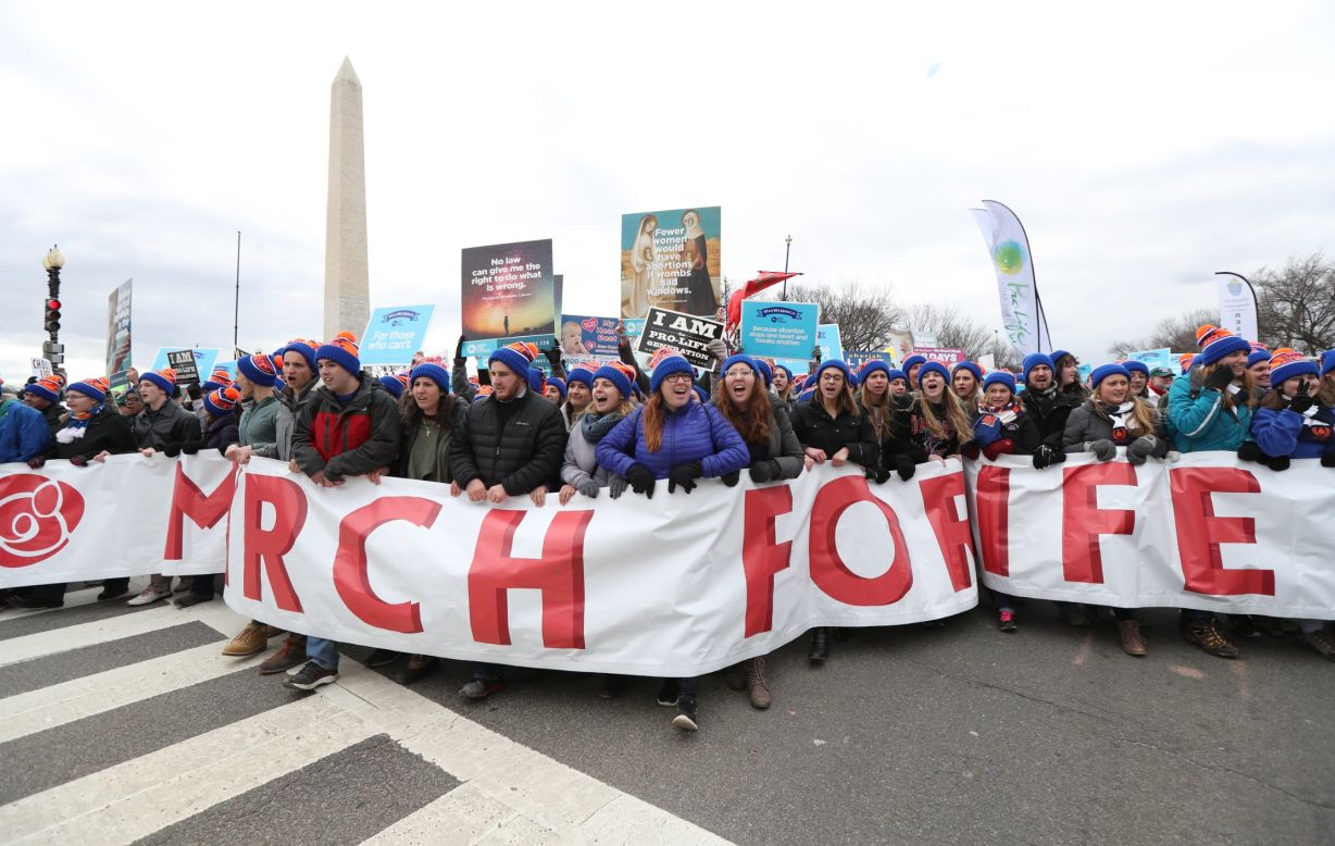 Participants march near the National Mall.