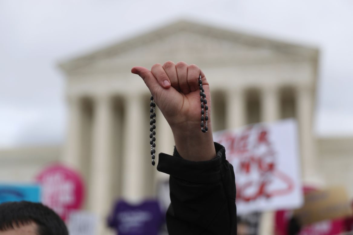 A participant holds up a rosary outside the Supreme Court. Anti-abortion activists are <a href="http://www.cnn.com/2016/12/14/politics/trump-abortion-supreme-court/" target="_blank">looking to Trump</a> as he is set to nominate a new Supreme Court justice in the coming weeks.