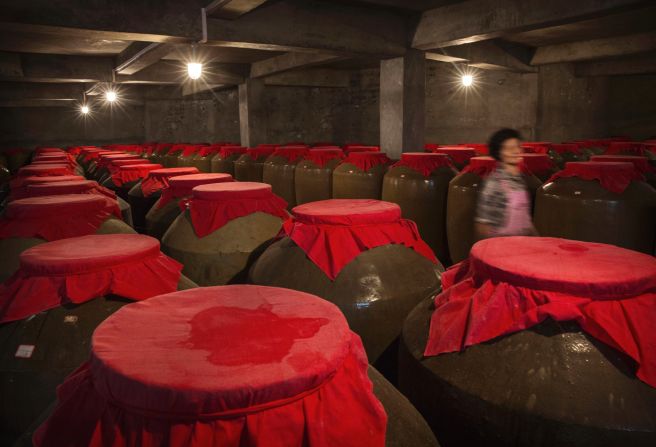 <strong>Four types of baijiu: </strong>Vats of fermenting baijiu are covered with red cloth. Baijius are categorized by four aroma profiles: rice, light, strong and sauce.  