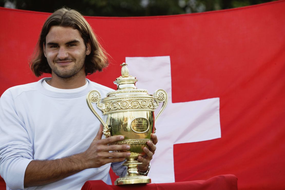 Federer poses with his first Wimbledon trophy in 2003.