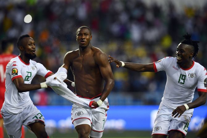 Prejuce Nakoulma strips off in celebration after scoring Burkina Faso's second goal.