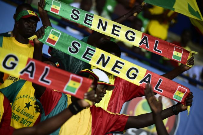 Senegal supporters cheer on their team -- many pundits tipped the 2002 runners up to win the tournament this year.  
