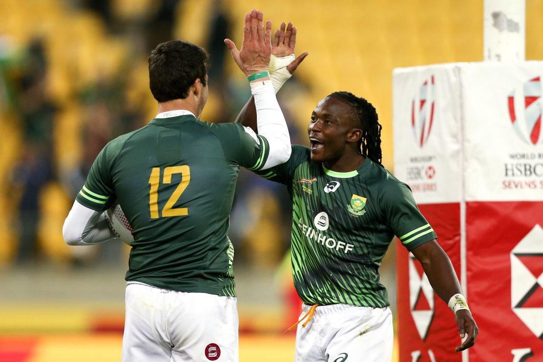 Ruhan Nel (left) celebrates with Player of the Final Seabelo Senatla after beating Fiji in the final.